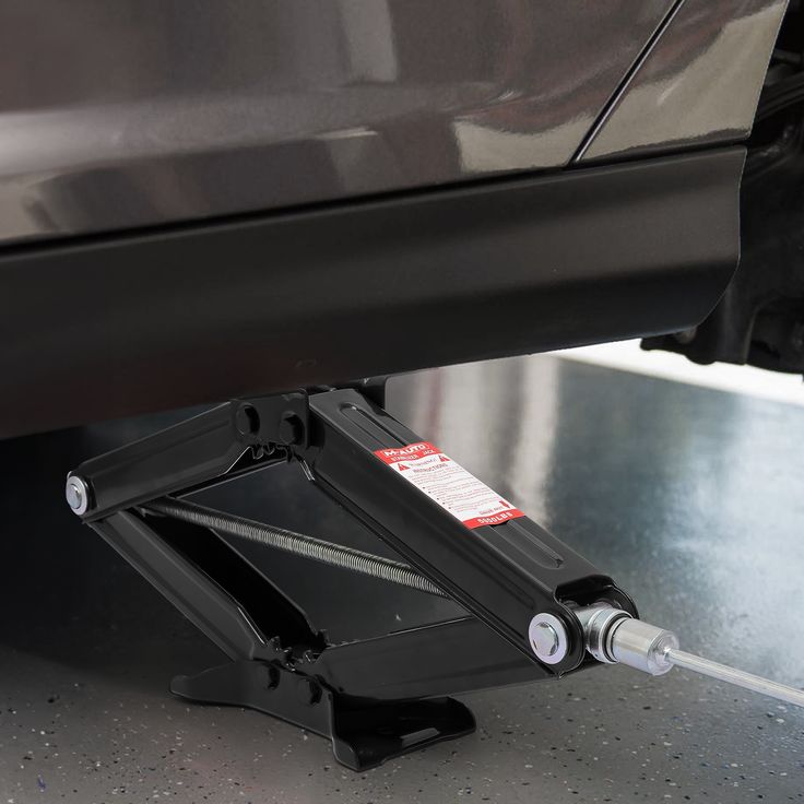 where to place car jack when changing tire