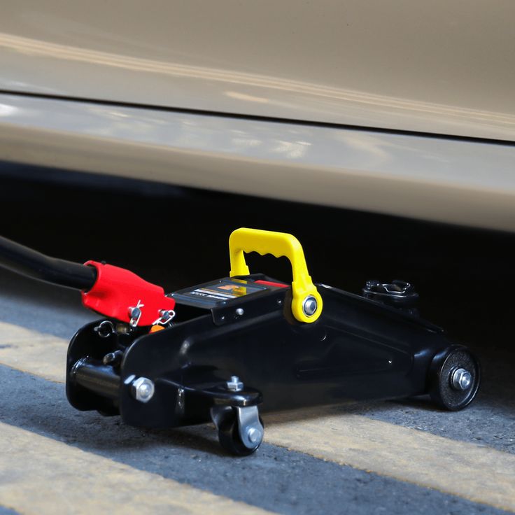 where to place car jack when changing tire