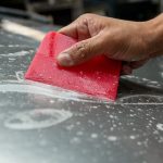 how to remove dealer decal from car
